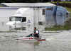 Houston_Flood_I10_trucks3.jpg (41032 bytes)